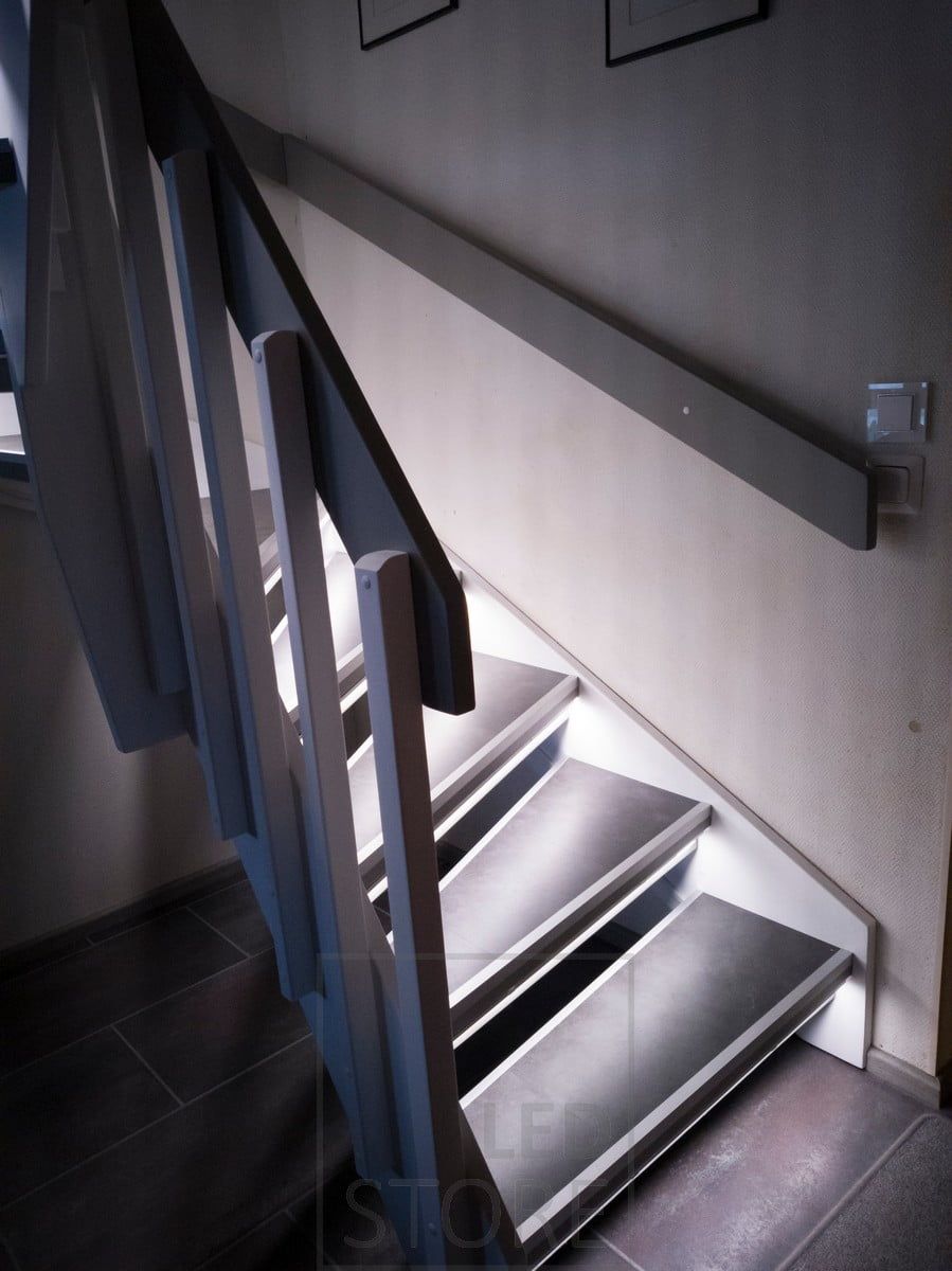 Staircase lighting with LED strips beautifully highlights the steps and accentuates the staircase.